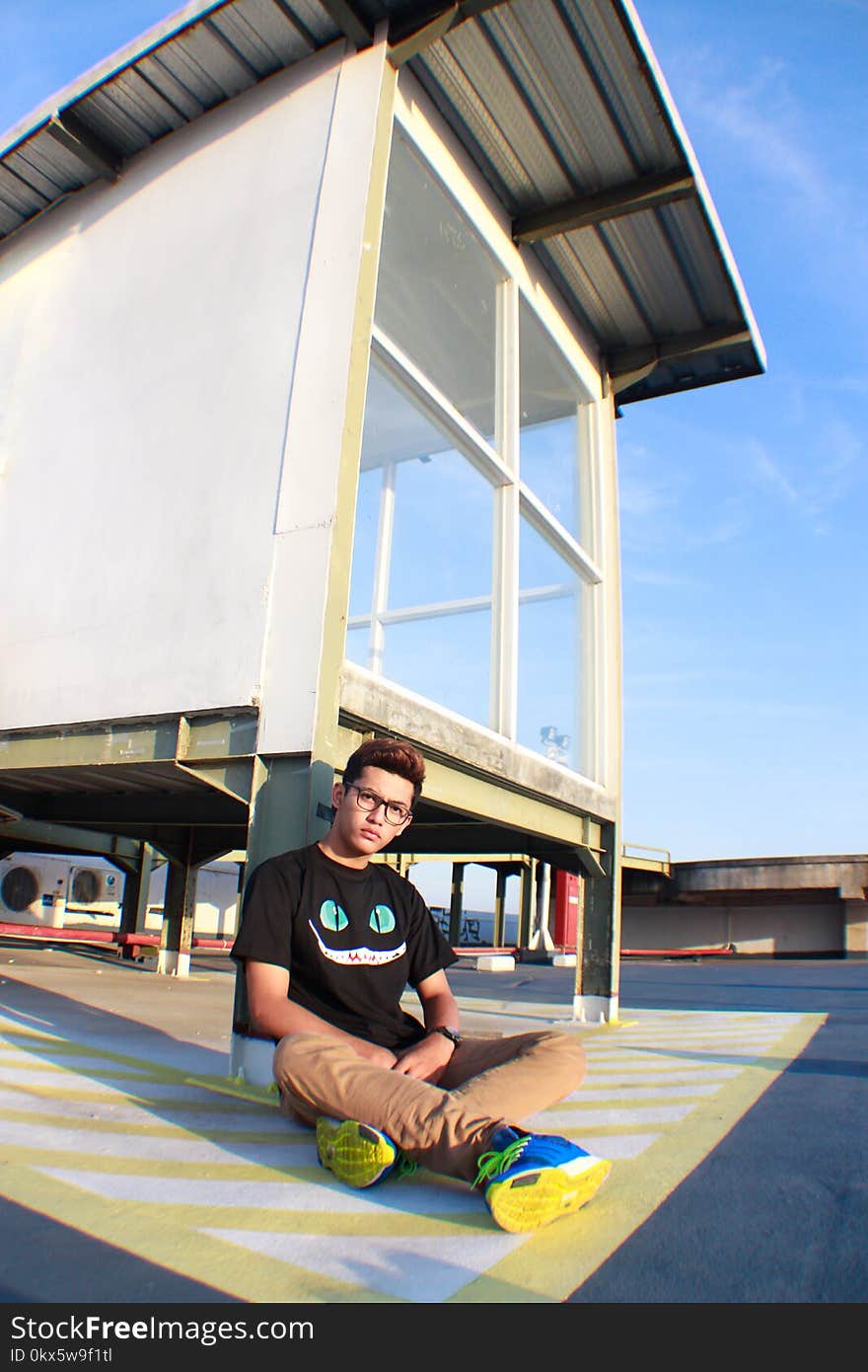 Man Sitting on Ground