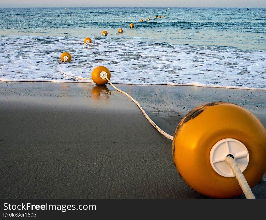 Sunny and sandy beach with a line of buoys. Sunny and sandy beach with a line of buoys