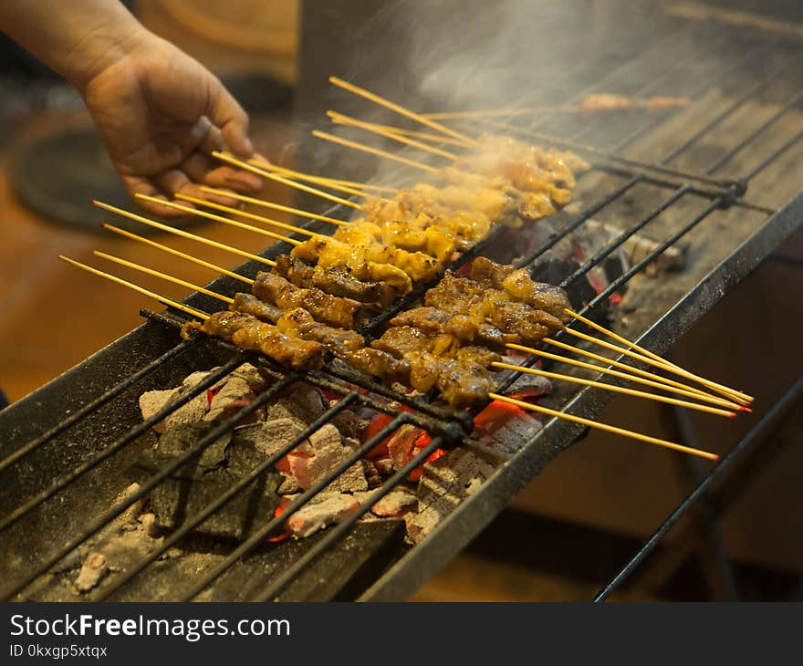 Asian street Food. People cooking, selling and buying Exotic Asian Food