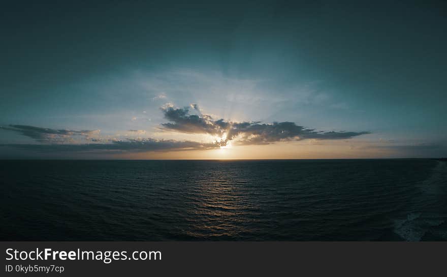 Body of Water and White Clouds Photo