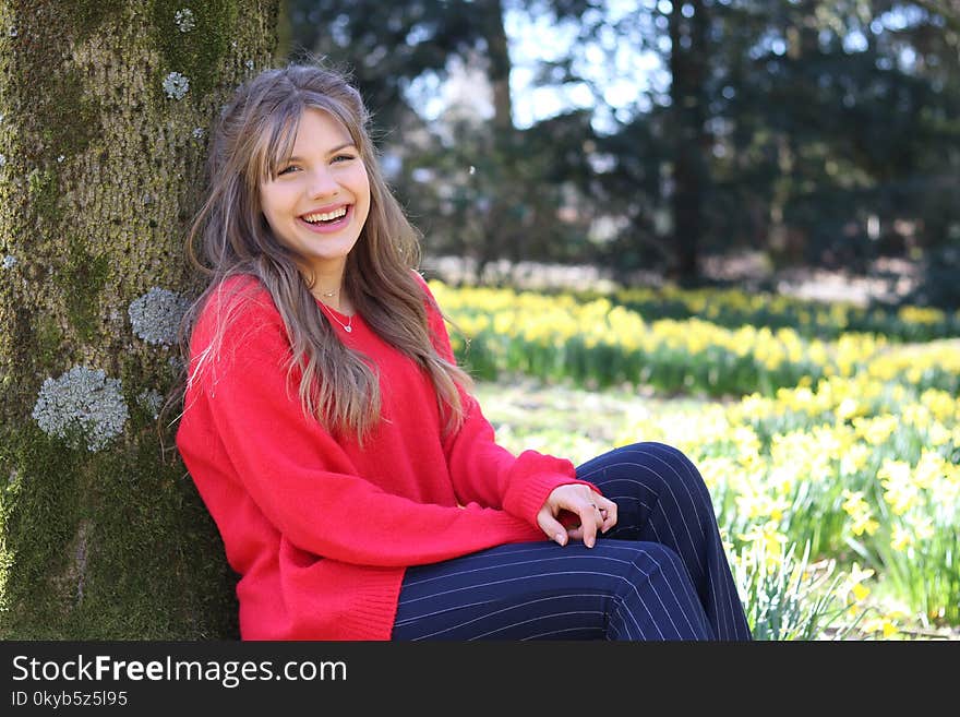 Smiling Woman Wearing Red Jacket