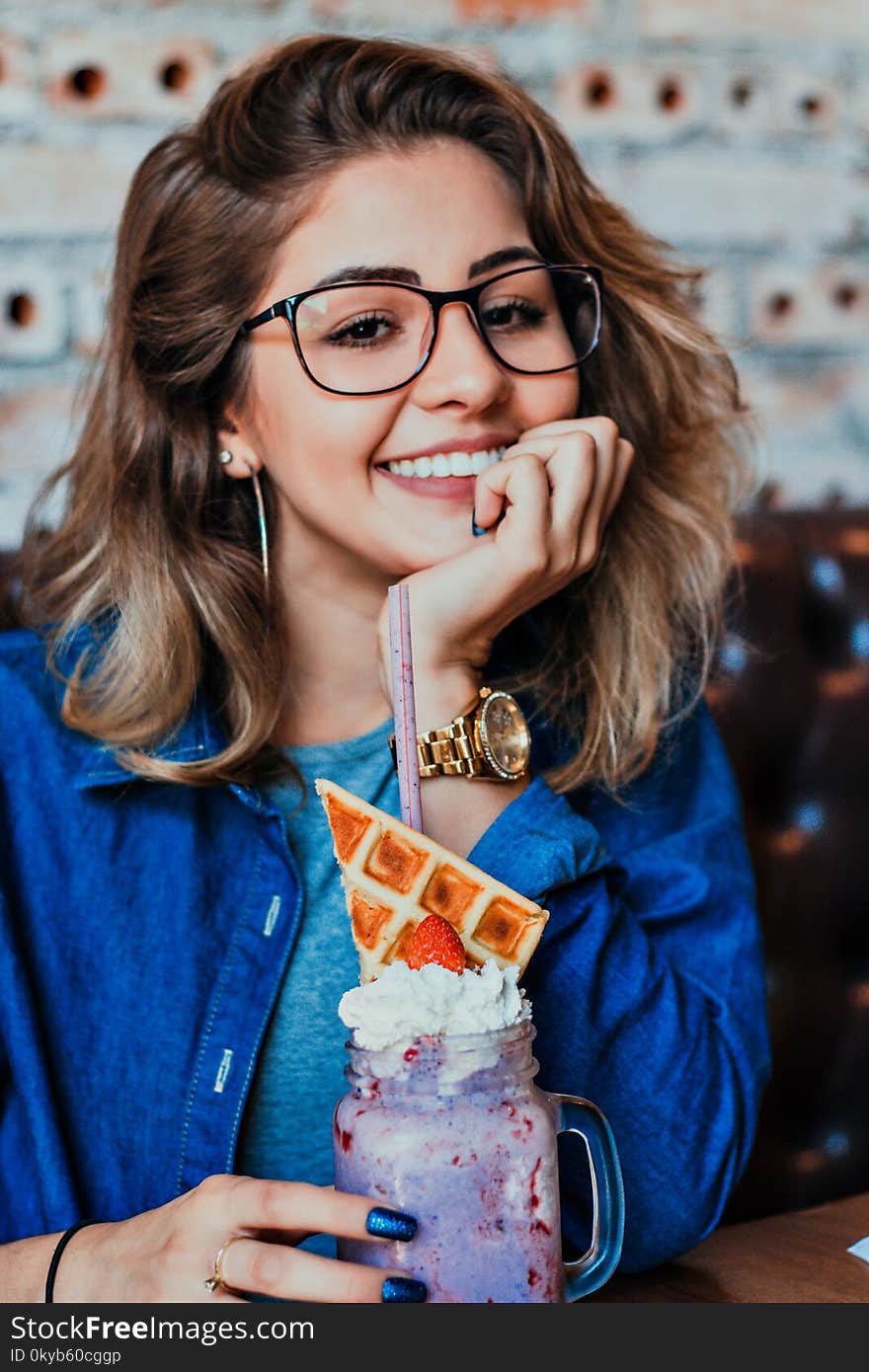 Woman in Eyeglasses With Black Frames Posing for Photo