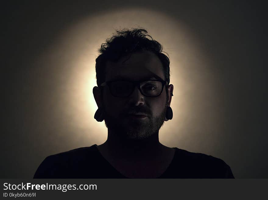 Man Wearing Black Shirt and Black Framed Eyeglasses