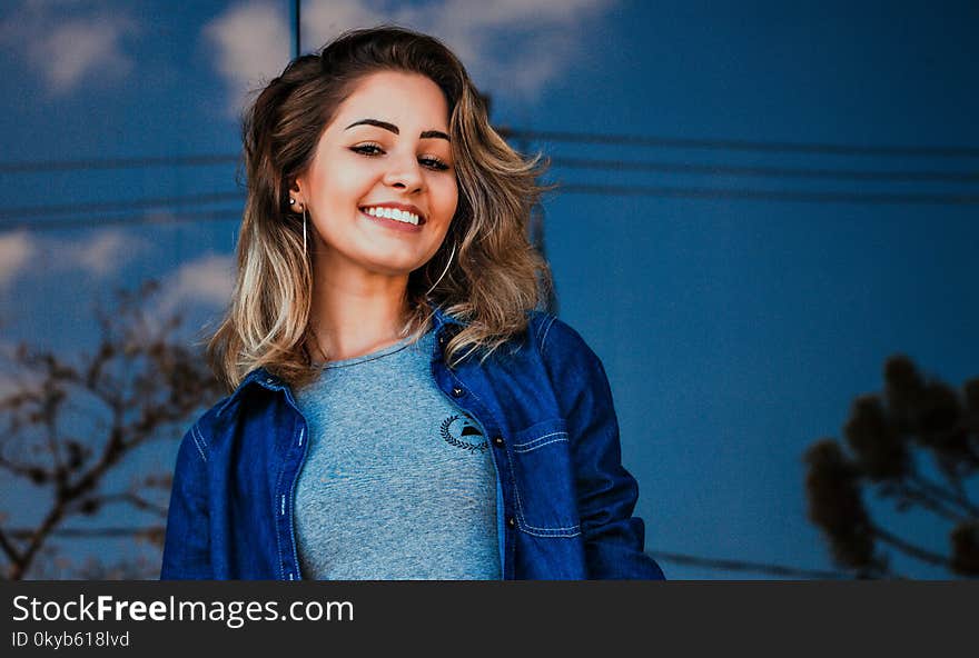 Woman Wearing Blue Shirt and Denim Jacket