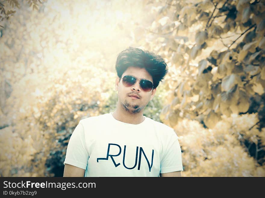 Man in White Crew-neck T-shirt With Sunglasses