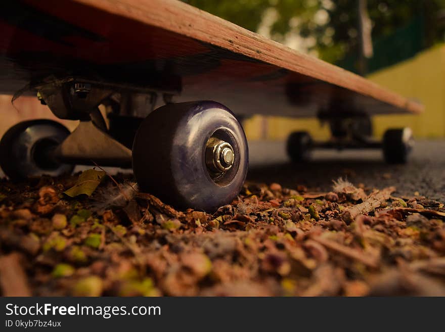 Brown Skateboard on Ground