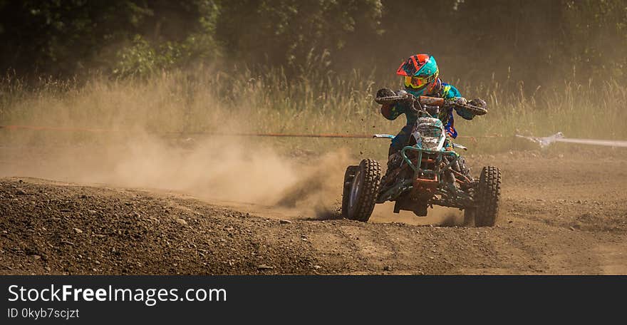 Man Riding Atv on Race Track