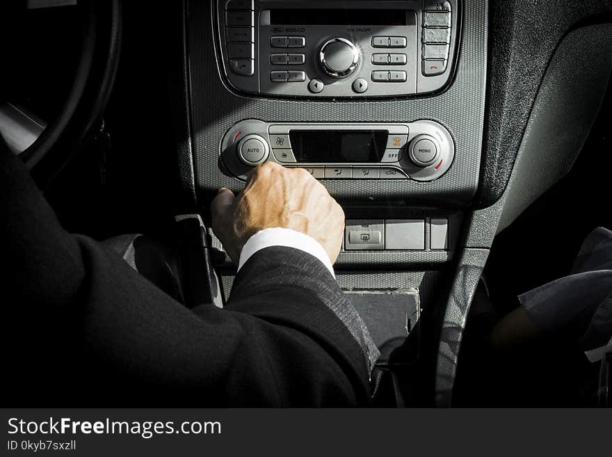 Man in Black Suit Inside Car