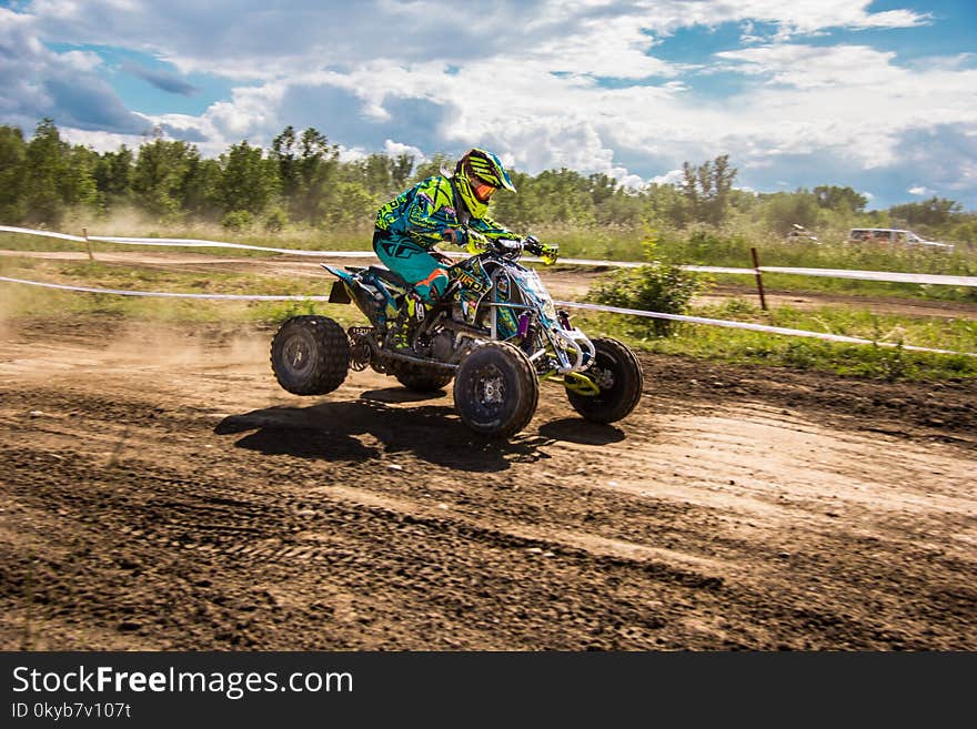 Person Riding Atv Under Sunny Sky