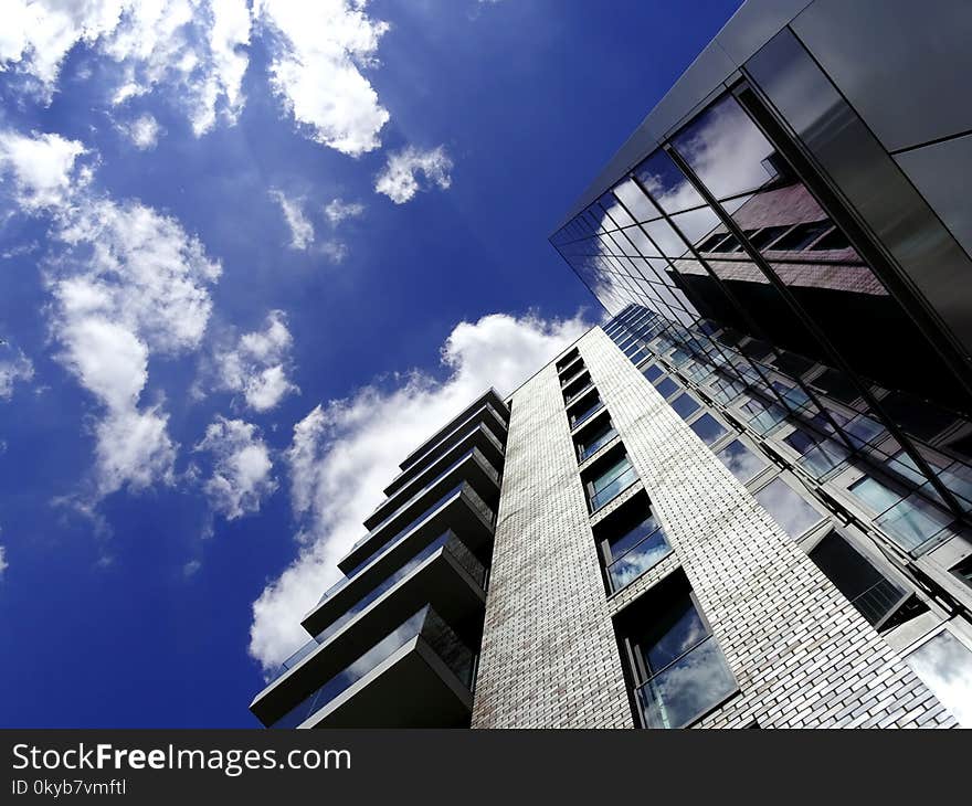 Low Angle of High-rise Building With Cloudy Sky