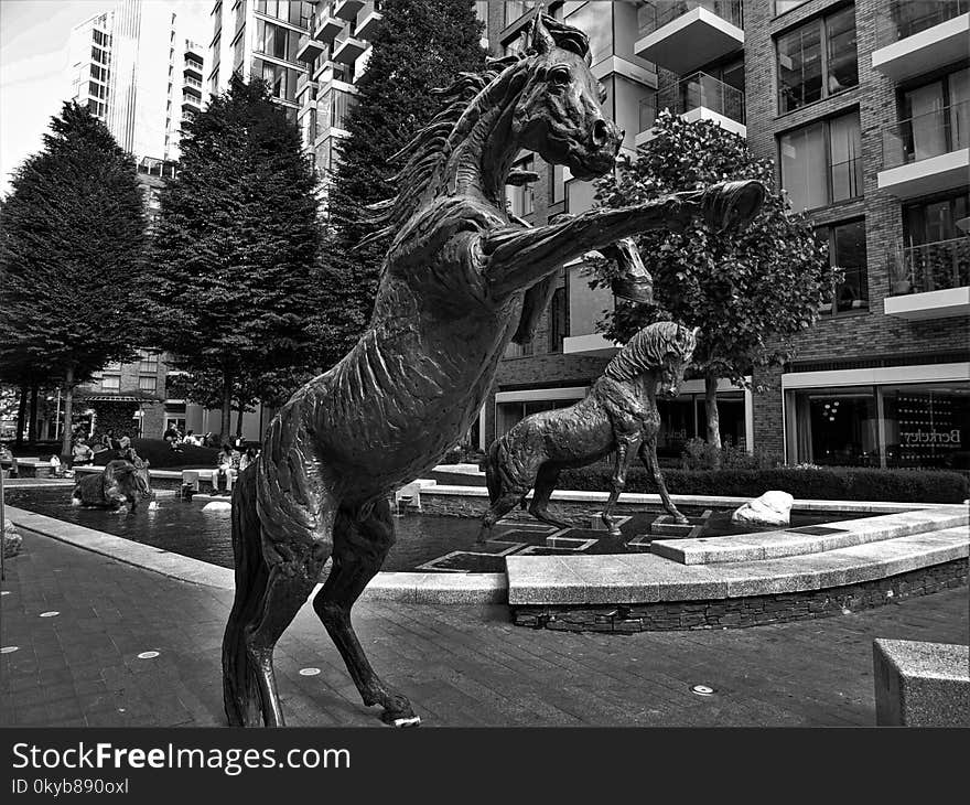 Grayscale Photo of Horse Staue