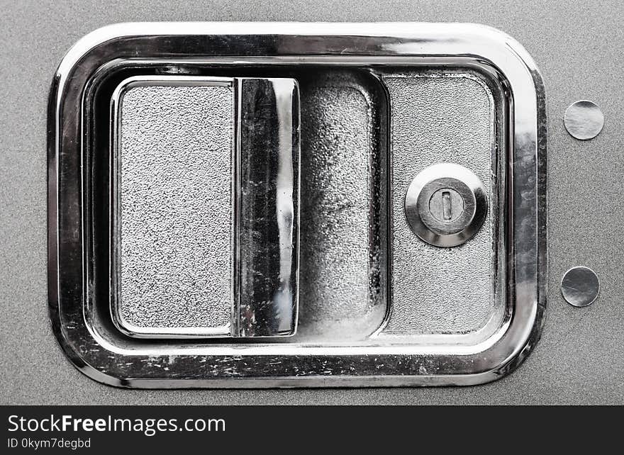 Close up of exterior chrome semi truck door handle.