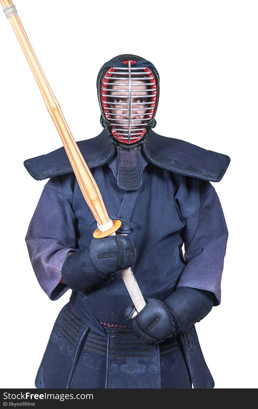 Swordsman in attacking position and protective equipment `bogu`