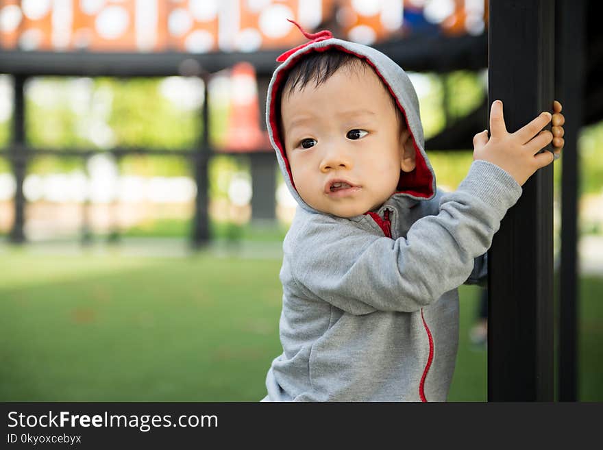 Portrait of little Asian baby boy at outdoor park