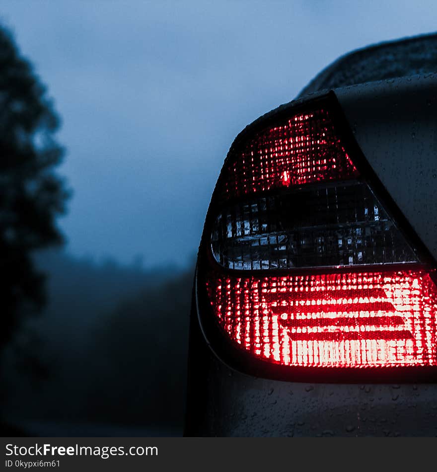 Dark moody and sad gloomy sedan lights from the back. Dark moody and sad gloomy sedan lights from the back