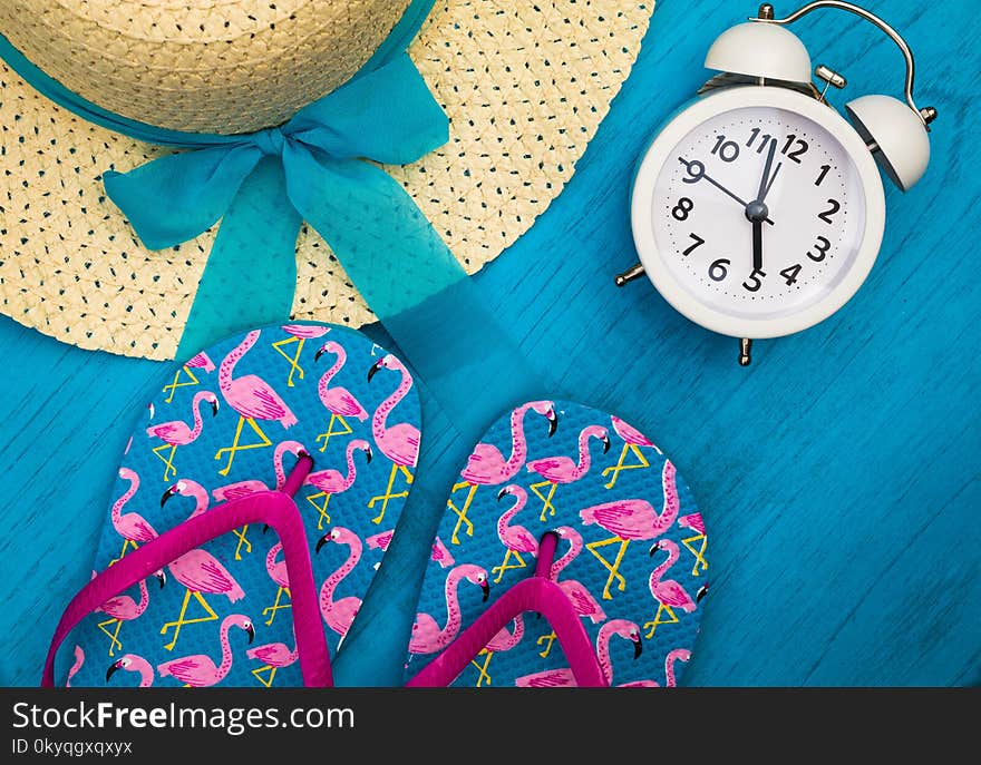 Vacation and Travel still life concept in bright colors and blue board, flat lay in vintage tones. Warm weather beach resort vacation holiday objects.