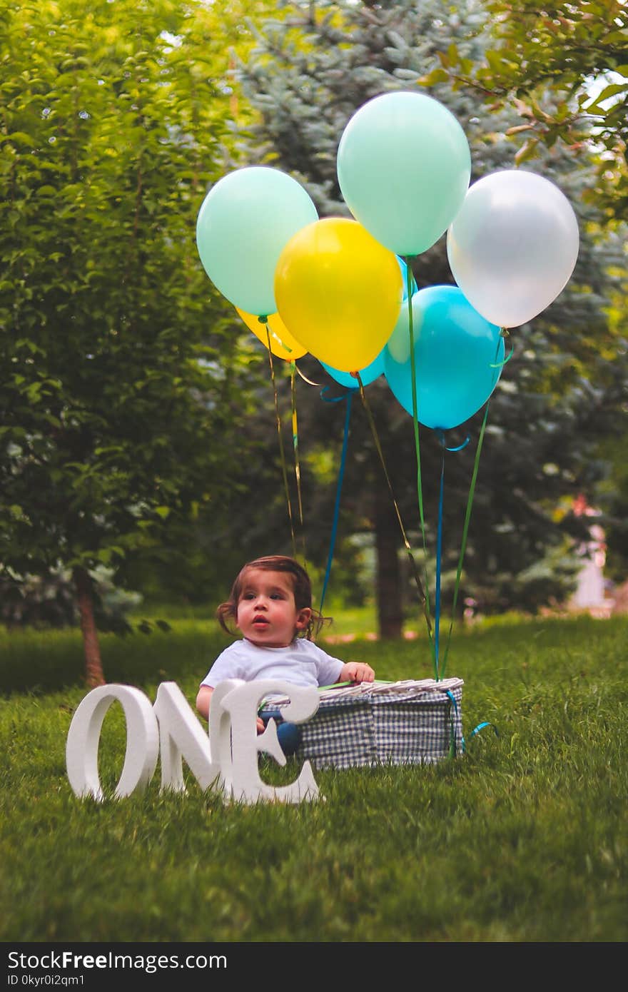 Girl and Assorted Color Balloons