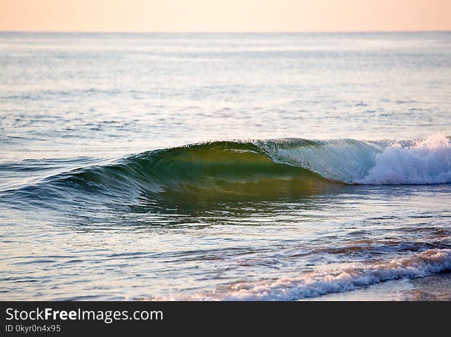 Green Body of Water With Wave