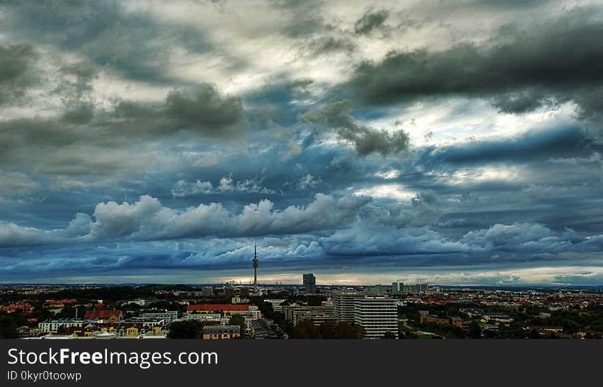 Photography of the City under Cloudy Skies