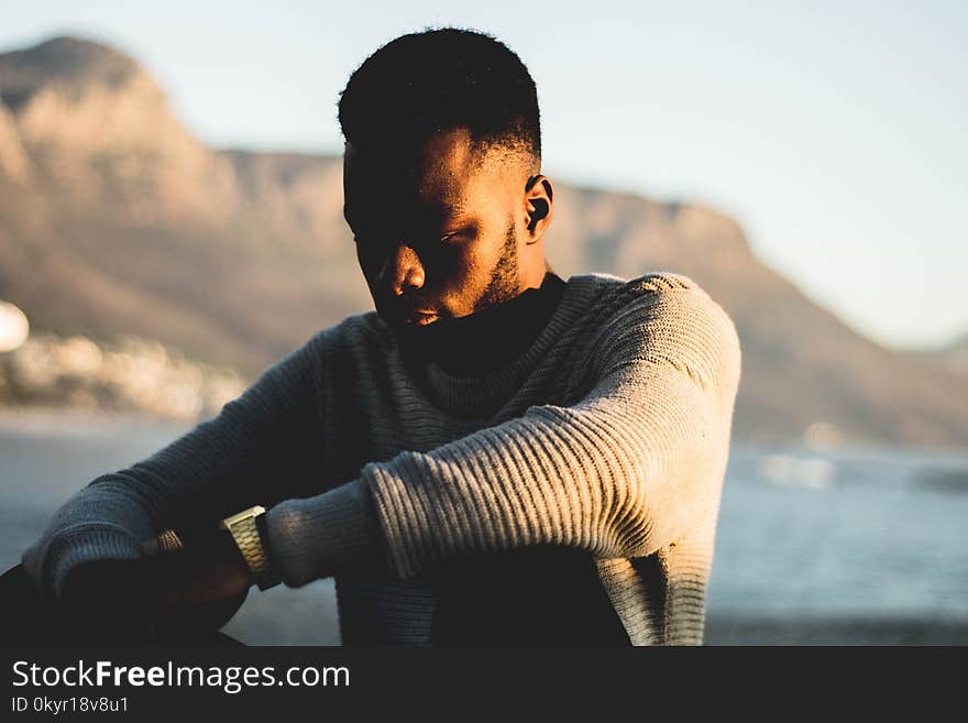 Man Wearing Gray Sweater in Selective Focus Photography