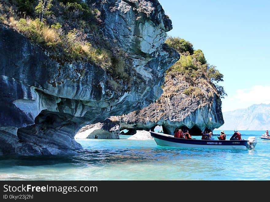 People Riding Motor Boat