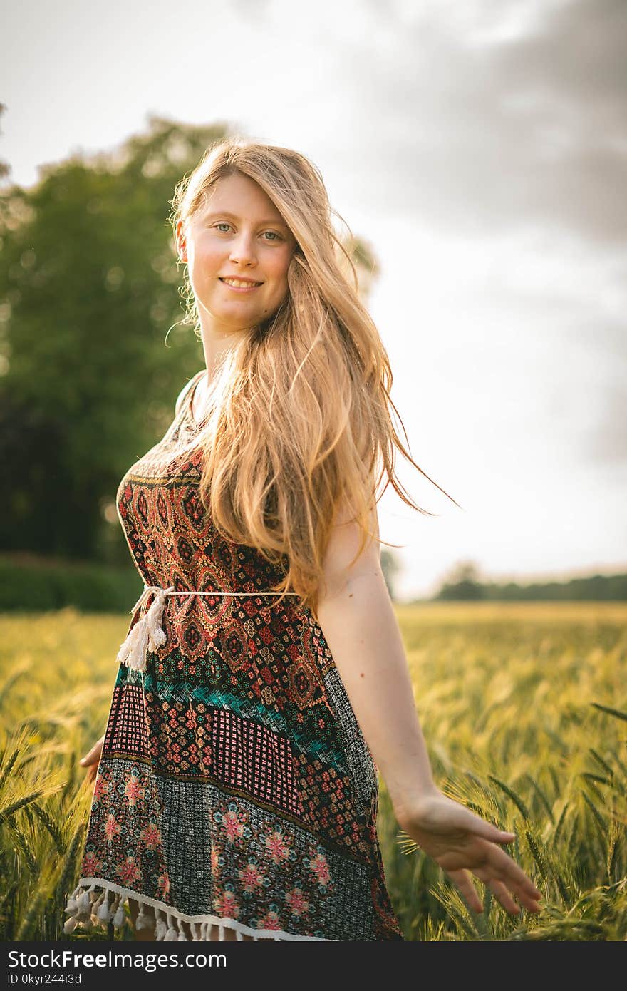 Woman in Brown-and-blue Dress Standing in Wheat Field