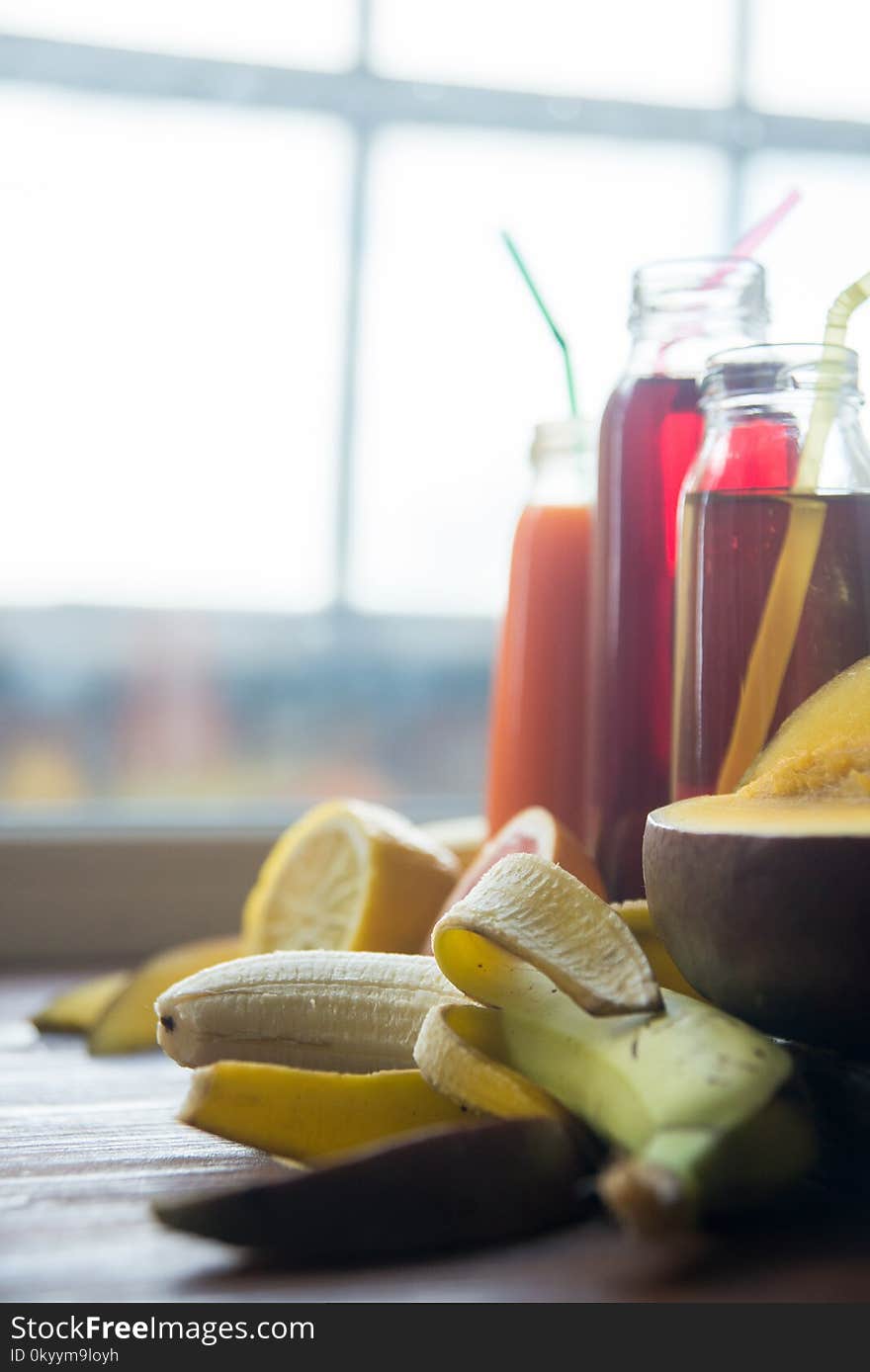 Delicious array of fresh fruit juices served in tall glasses made from liquidised orange, kiwifruit with peppermint, and strawberr