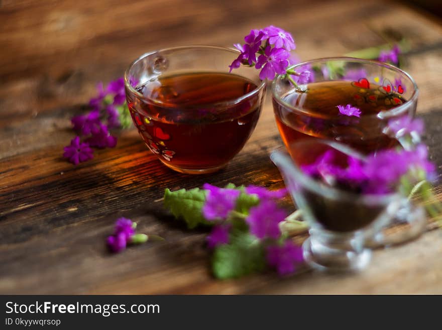 brew flower tea in a cup on a wooden table. brew flower tea in a cup on a wooden table.