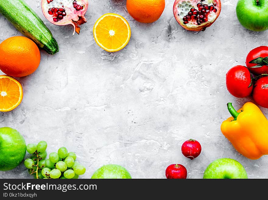 Fresh vegetables and fruits for fitness dinner on stone desk background top view mockup. Fresh vegetables and fruits for fitness dinner on stone desk background top view mockup