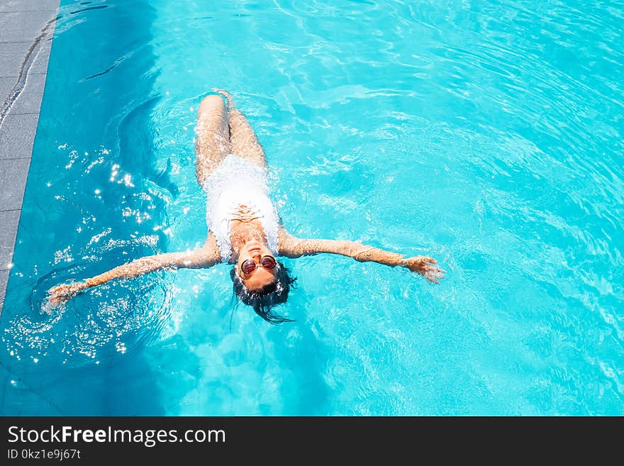 Woman Relax In Swimming Pool