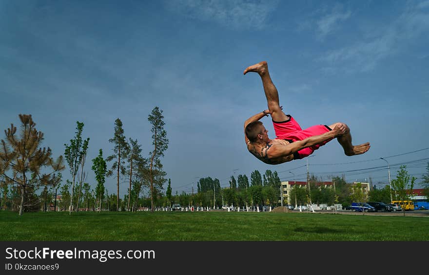 Tricking on lawn in park