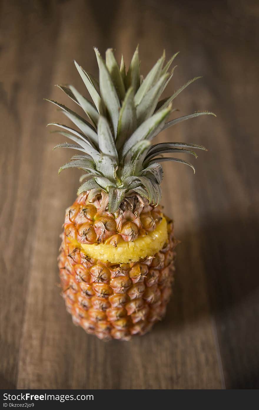 Sliced Pineapple Fruit on a Wooden Table Top