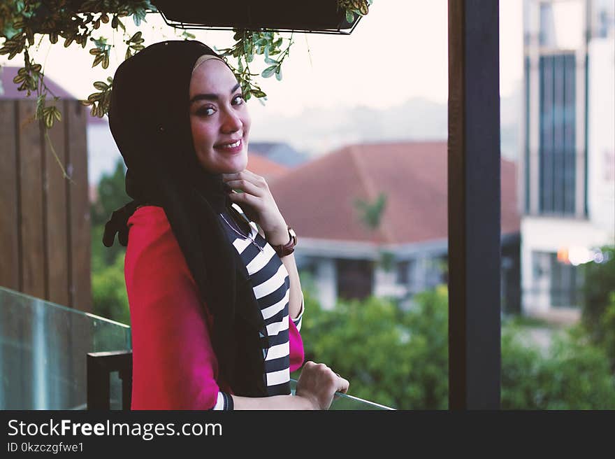 Woman standing on a balcony