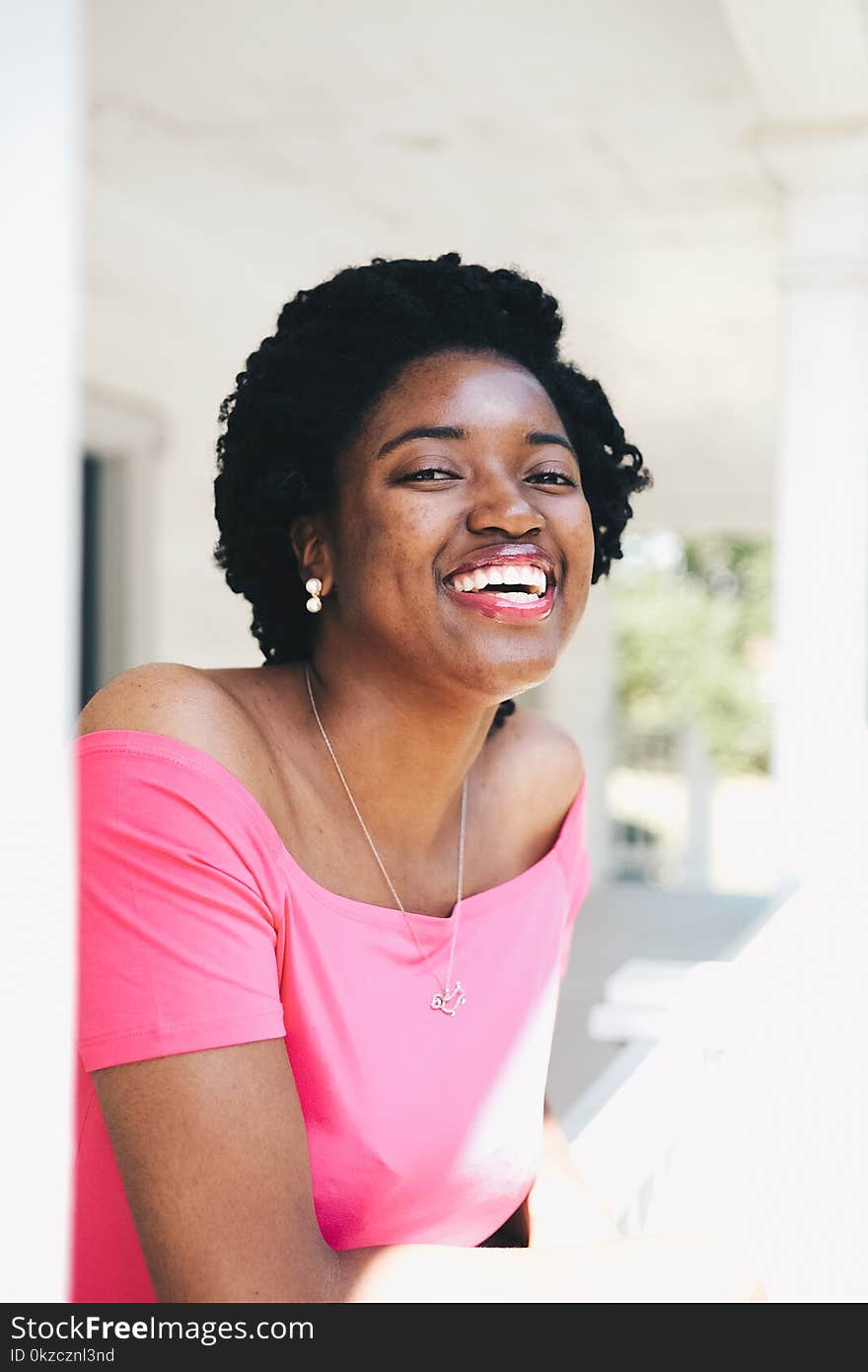 Smiling Woman Wearing Pink Off-shoulder Top