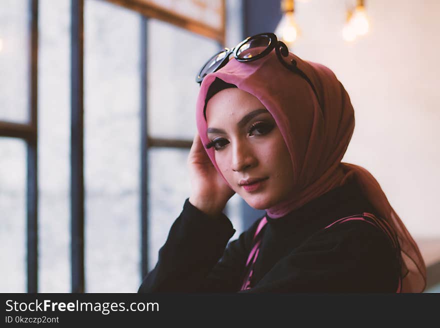 Woman in Pink Headdress With Sunglasses on Her Head