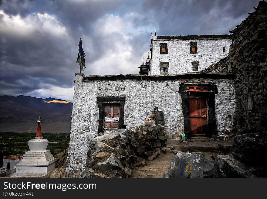 Concrete House Under Cloudy Sky