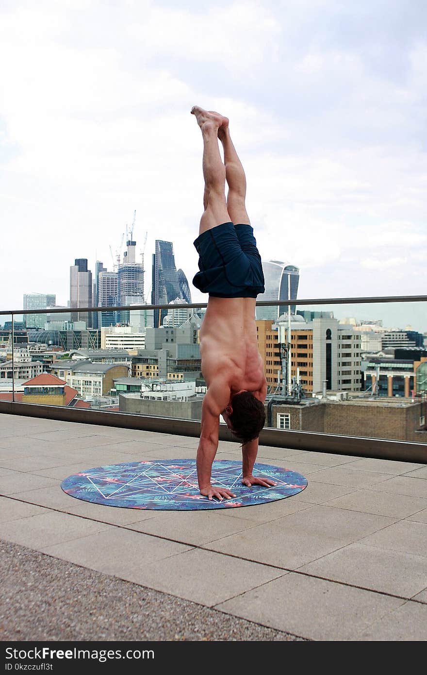 Man Wearing Black Shorts Doing Hand Stand