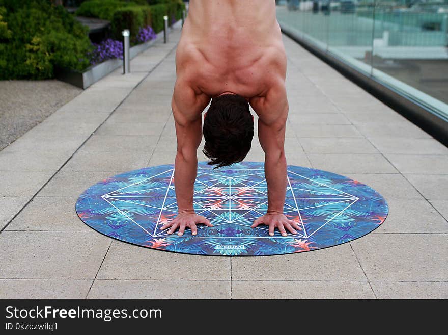 Man On Round Blue Floral Mat