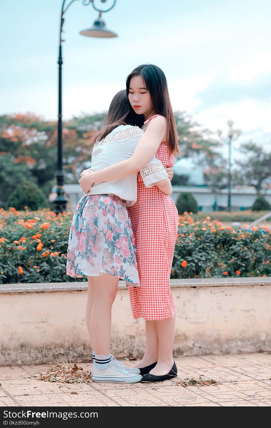 Two Woman Hugging Eachother