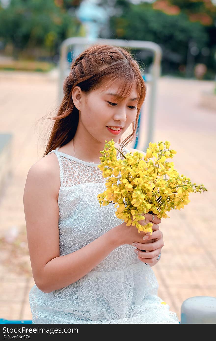 Woman Holding Yellow Petaled Flower Bouquet