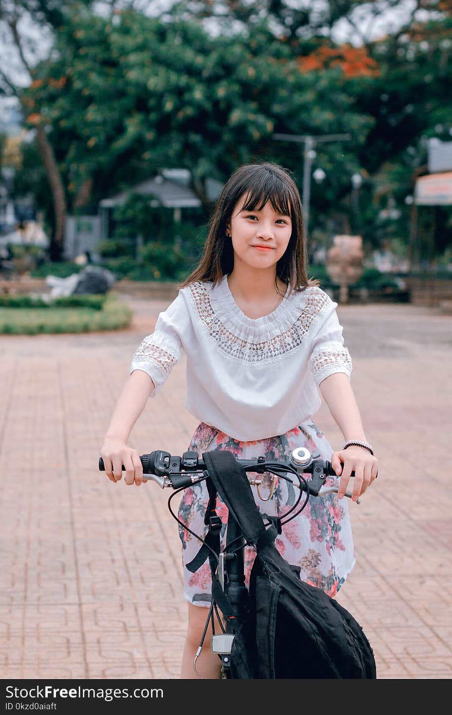 Woman Riding Bicycle