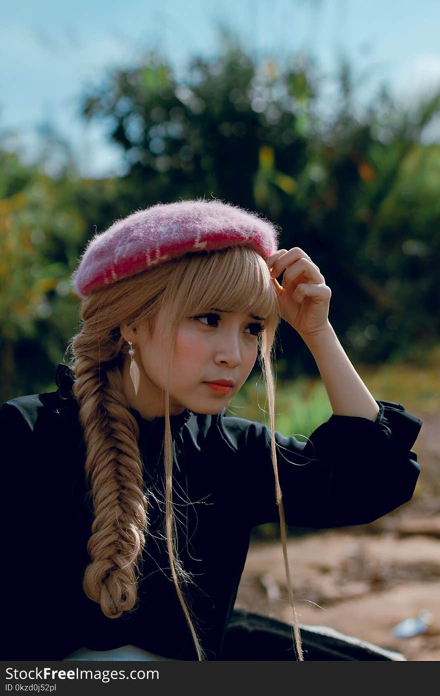 Close-Up Photography of a Woman With Braided Hair