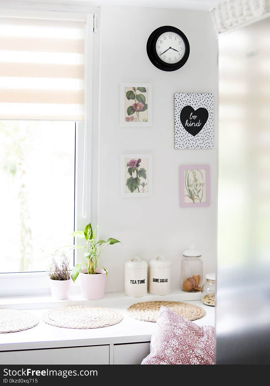 Pots Near Windowpane on White Wooden Cabinet