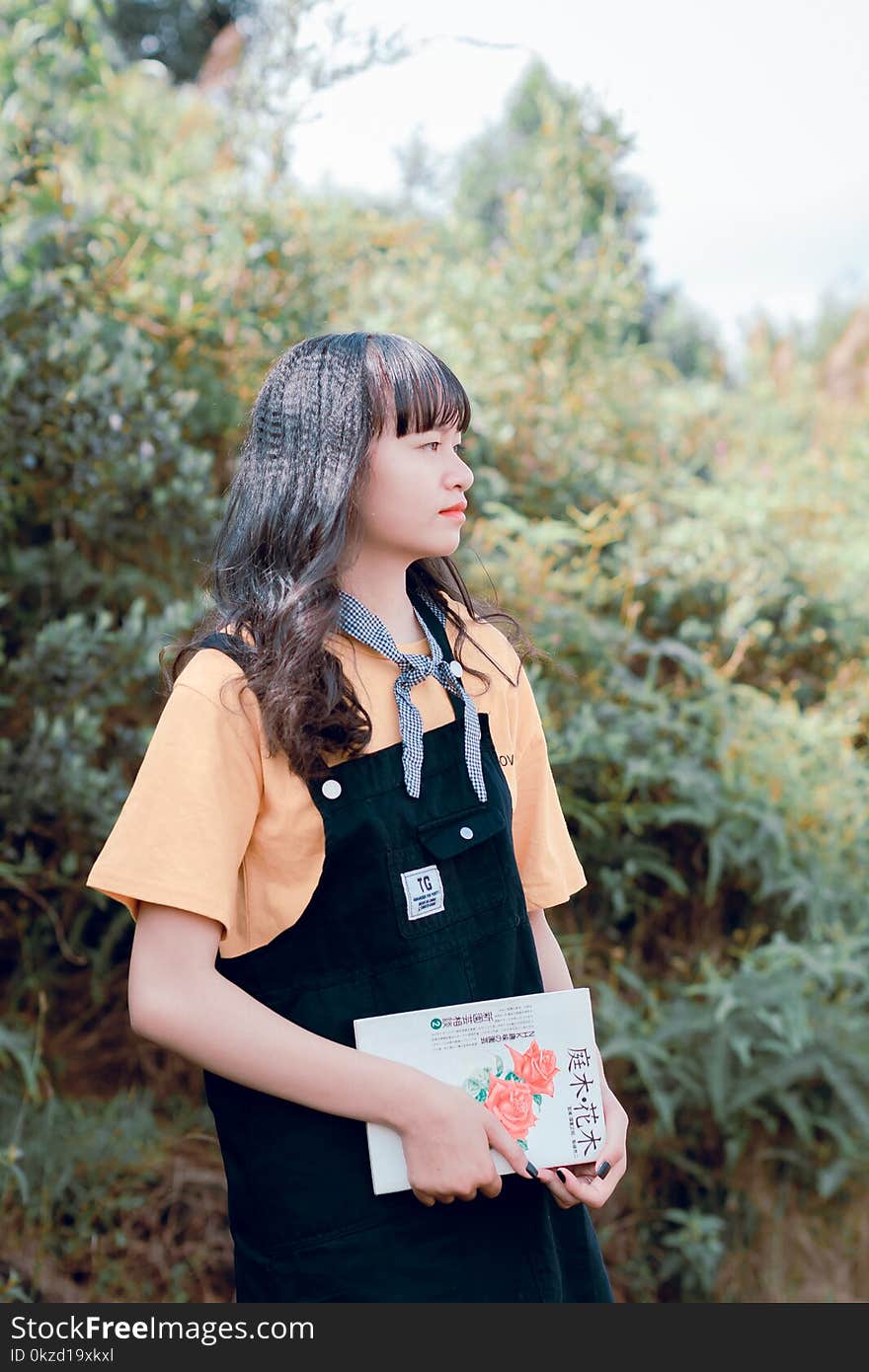 Woman Holding Book