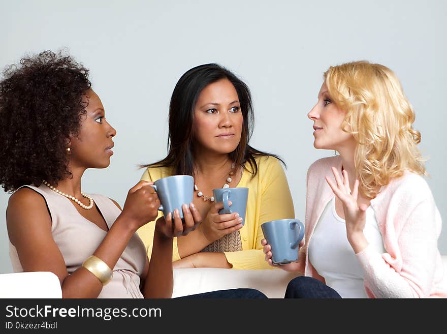 Diverse Group Of Friends Having Coffee And Talking.