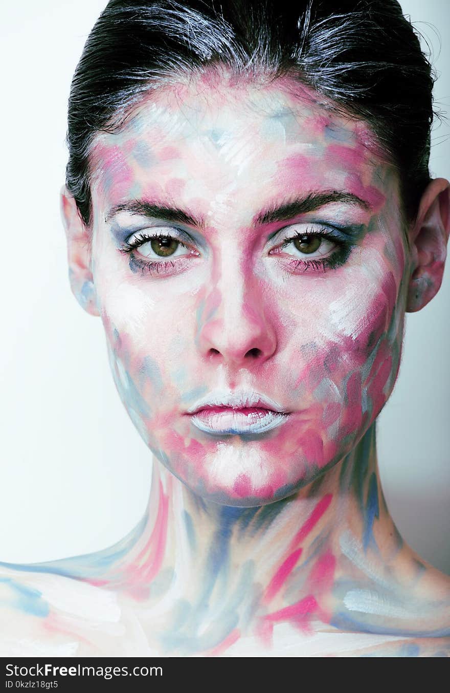 Young woman with creative make up like painted oil picture on face closeup