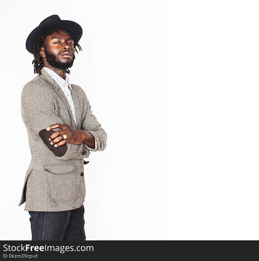 Young handsome afro american boy in stylish hipster hat gesturing emotional isolated on white background smiling, lifestyle people concept close up