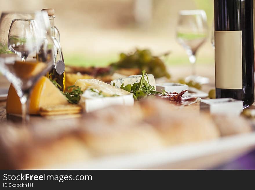 Cheese Board And Red Wine On A Table