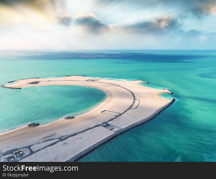 Piece Of Sand In The Ocean. Beach And Water, Aerial View