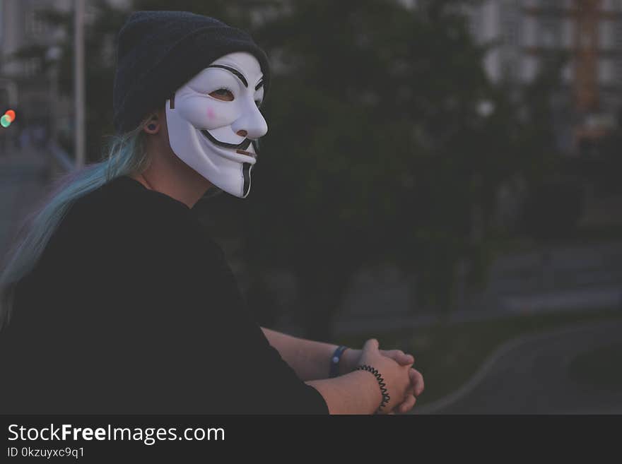 Woman Wearing White Guy Fawkes Mask